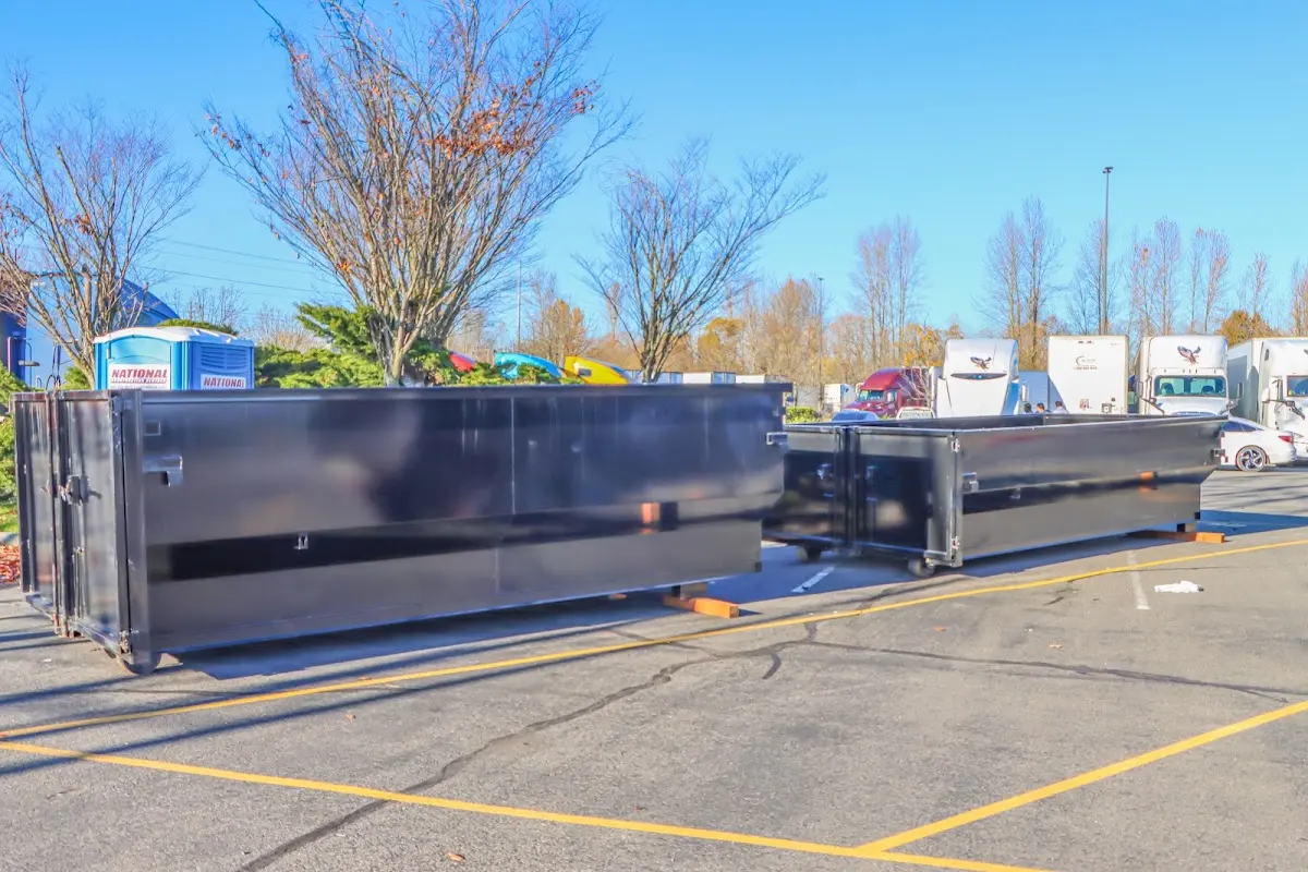 Professional dumpster rental service with roll-off container on residential driveway in Kennedale